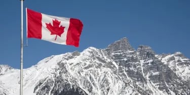 Canada flag in mountains