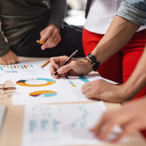 Colleagues going through paperwork in office