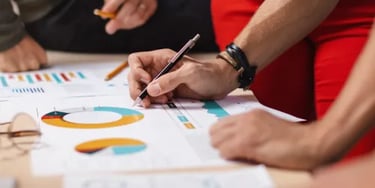 Colleagues going through paperwork in office
