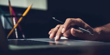 Close up of hand using laptop - right
