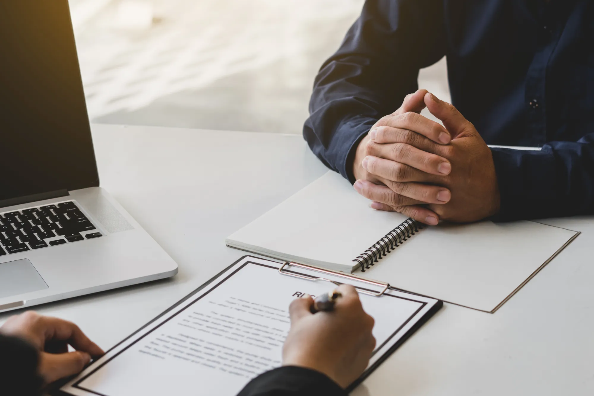 Job interviewer examining resume