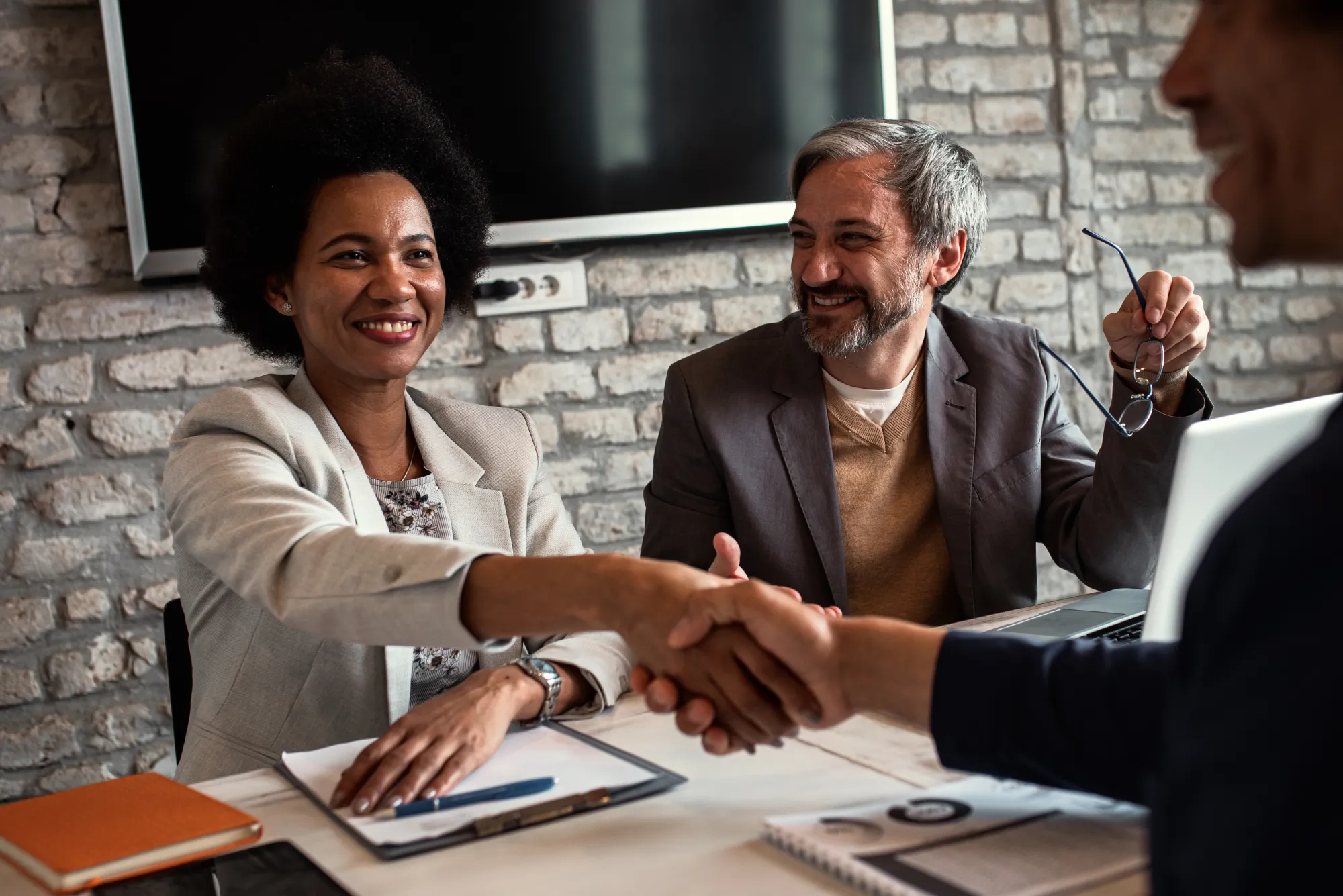 Recruiters shaking hands with candidate