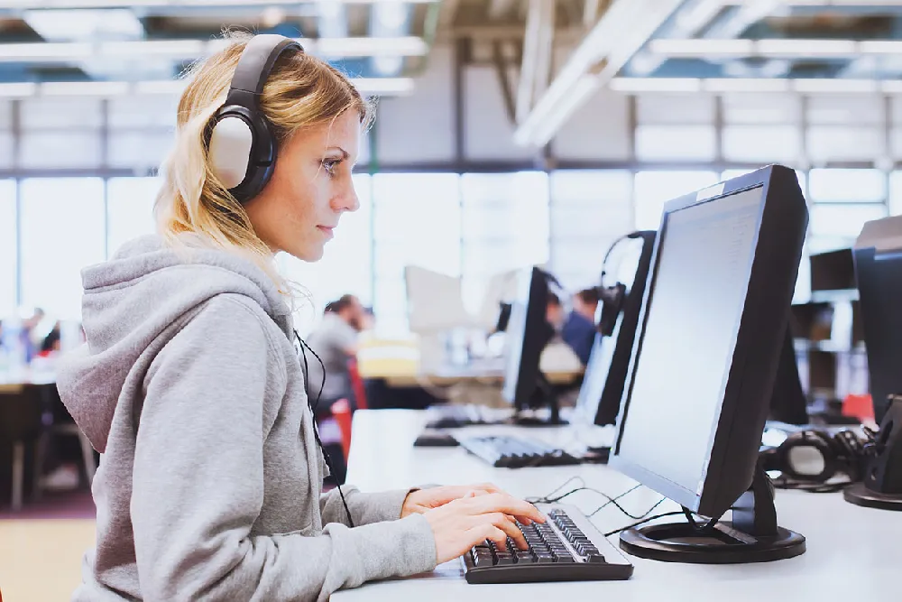 Woman using a computer right