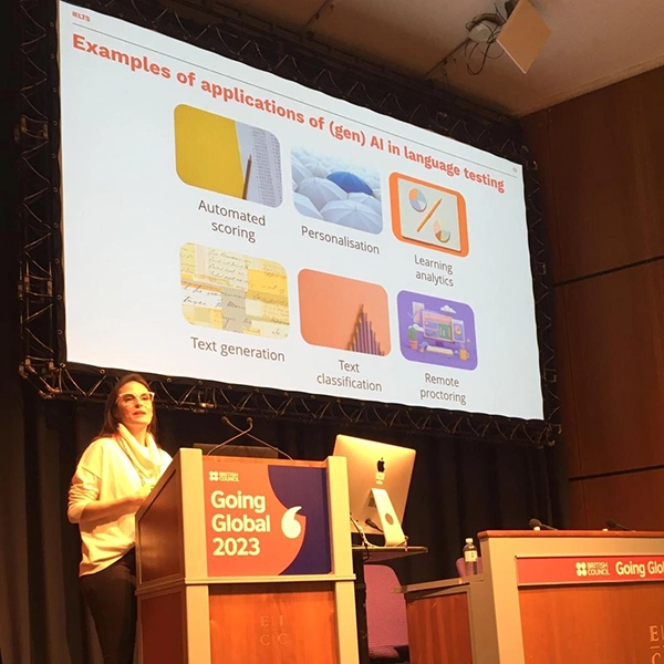 Carla Pastorino-Campos speaking at a conference podium during Going Global