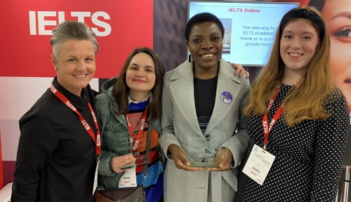 Natalia Larchenko and Chi Anestin Lum receiving IELTS scholarship awards at IATEFL