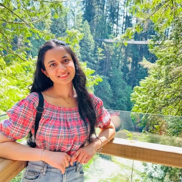 IELTS test taker standing on forest bridge viewpoint in Canada