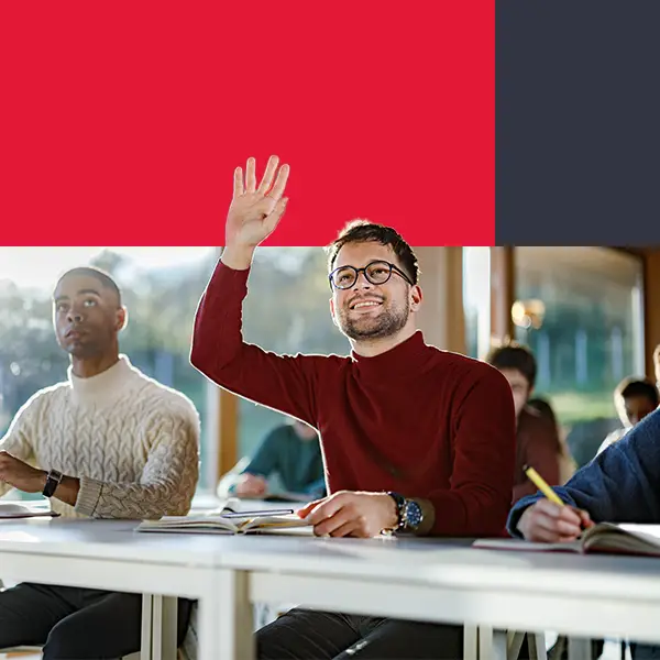 Student raising hand in university classroom webp