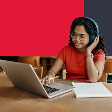 Student studying with laptop and headphones