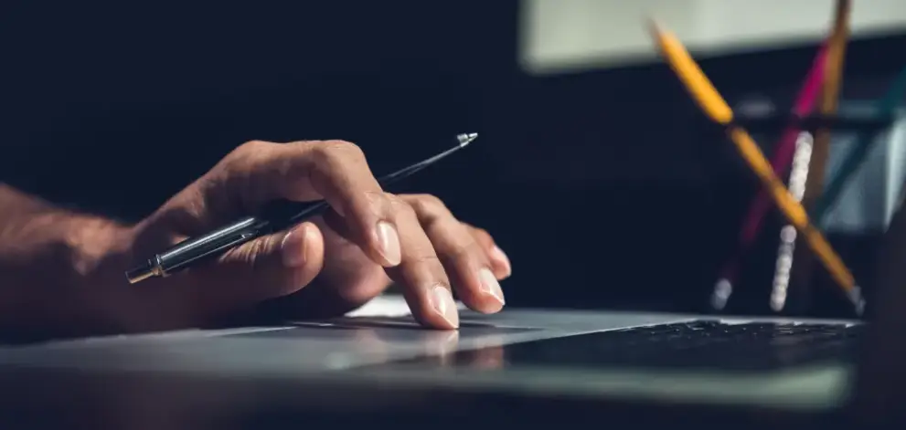 Close up of hand using laptop