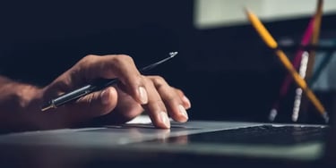 Close up of hand using laptop