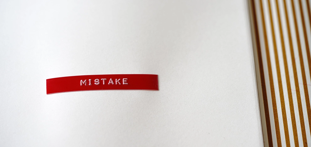 Word mistake printed on a page highlighting an error in written work