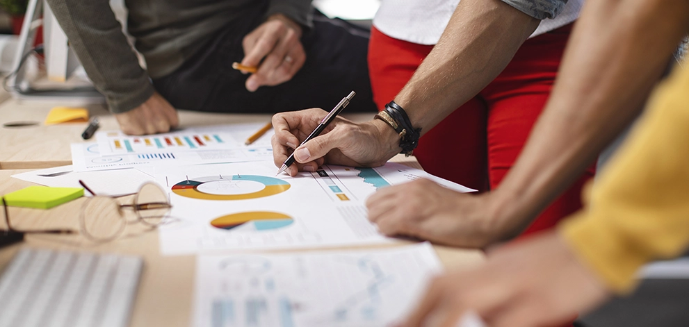 Students reviewing data and charts