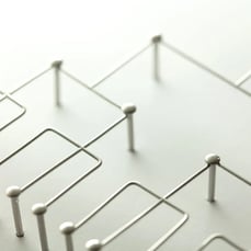 Abstract network structure formed by connected metal nodes and lines