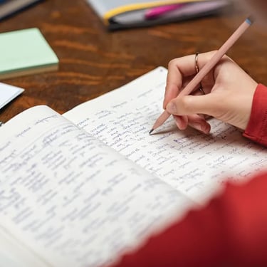 Woman writing in book