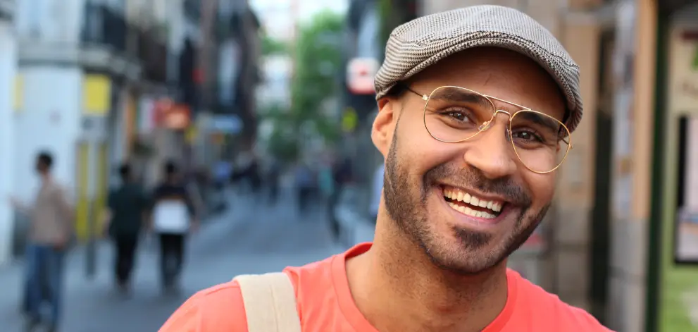 Smiling man on city street