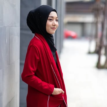 Professional woman wearing a headscarf standing in a city environment
