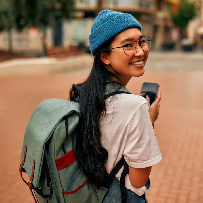 Student walking campus backpack - right