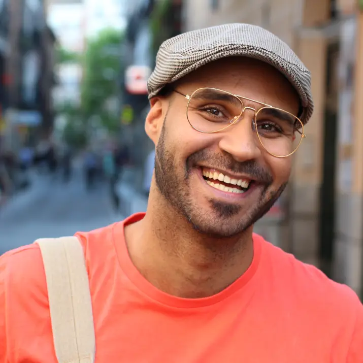 Smiling man on city street