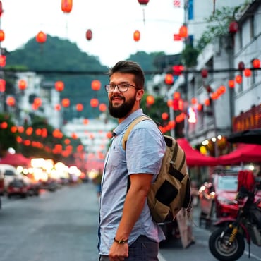 Traveller standing city street - left