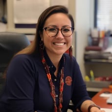 Woman smiling at desk