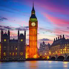 Big Ben and the Houses of Parliament beside the River Thames in London at sunset