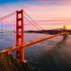Golden Gate Bridge spanning San Francisco Bay at sunset