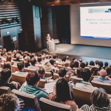 Speaker giving a talk in conference hall