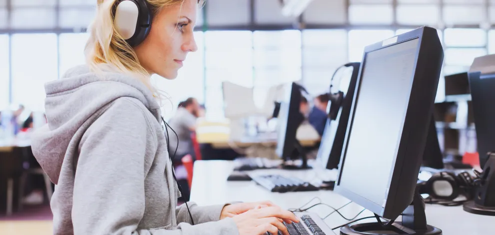 Female test taker using computer - right