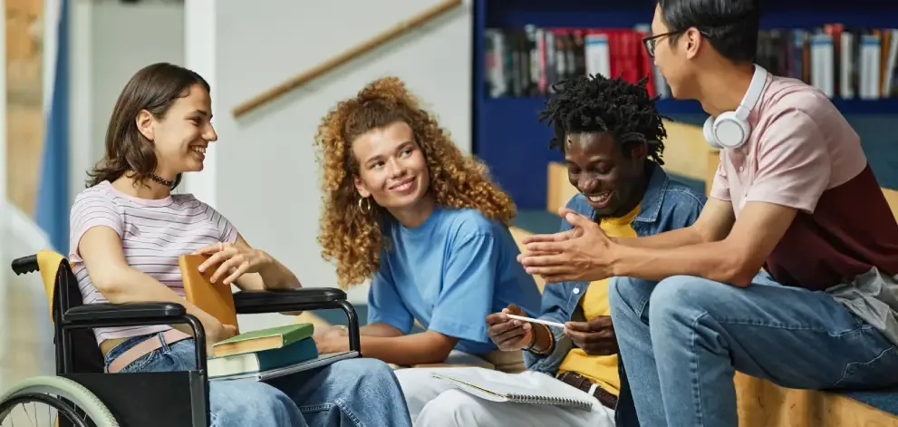 Group of diverse students in library setting