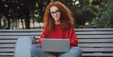 Student studying laptop outdoors university preparation