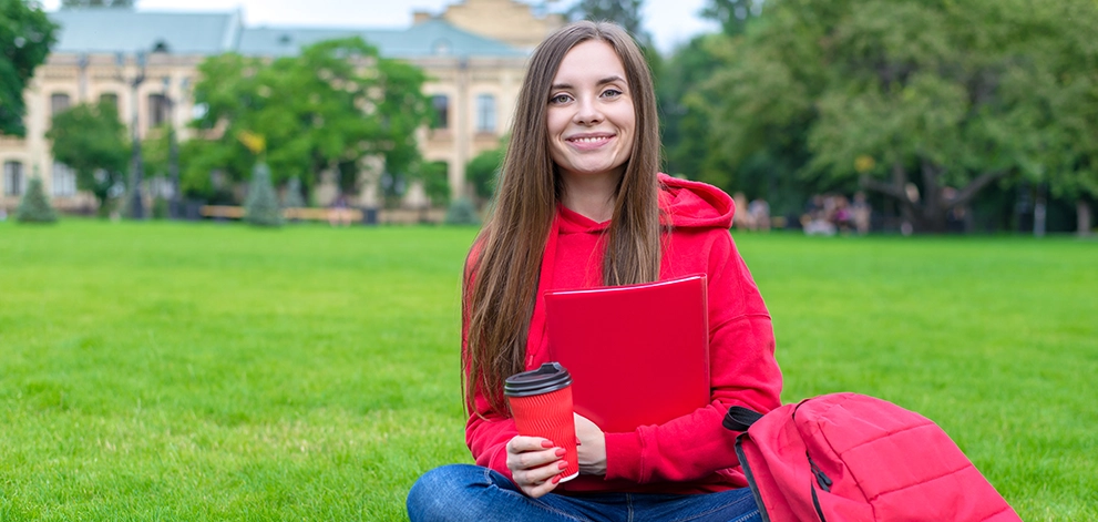 Student studying outdoors university campus
