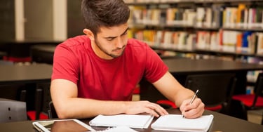 Man studying in library - right