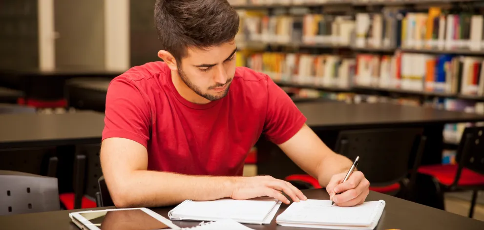 Man studying in library - right