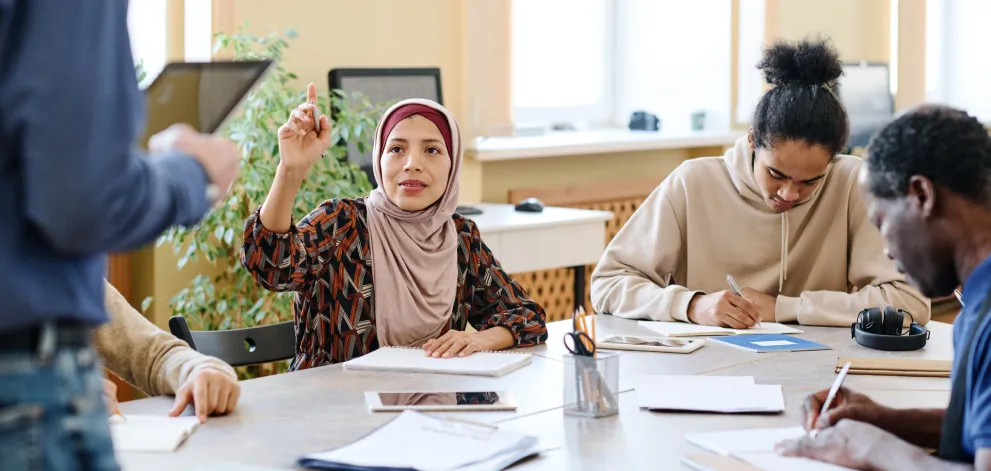 Teacher teaching a class of adults