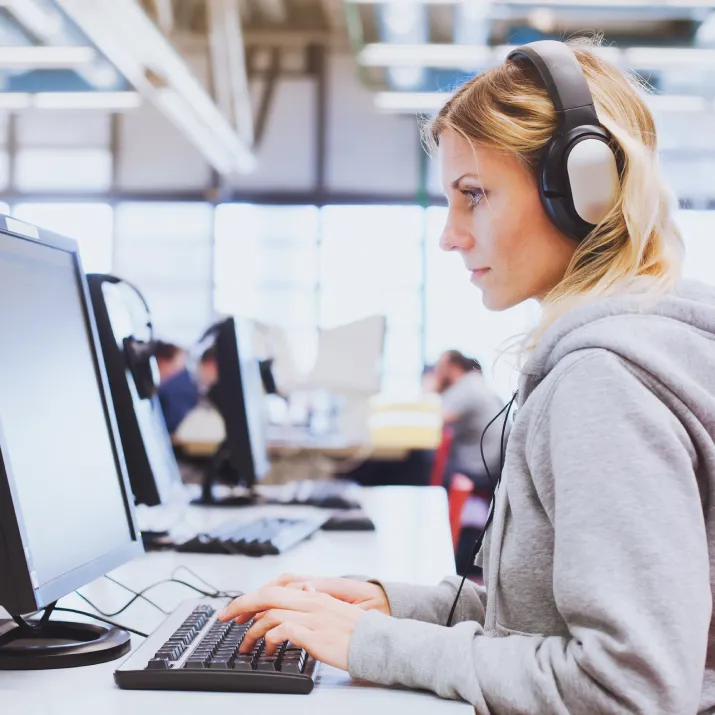 Female test taker using computer looking - left