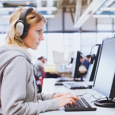 Female test taker using computer looking - right