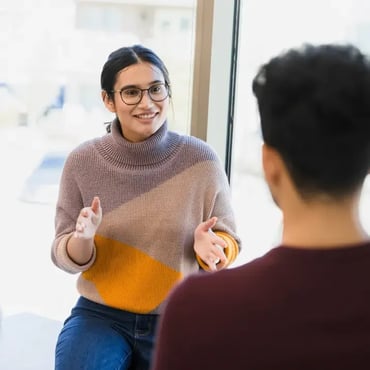 Students discussing study materials meeting