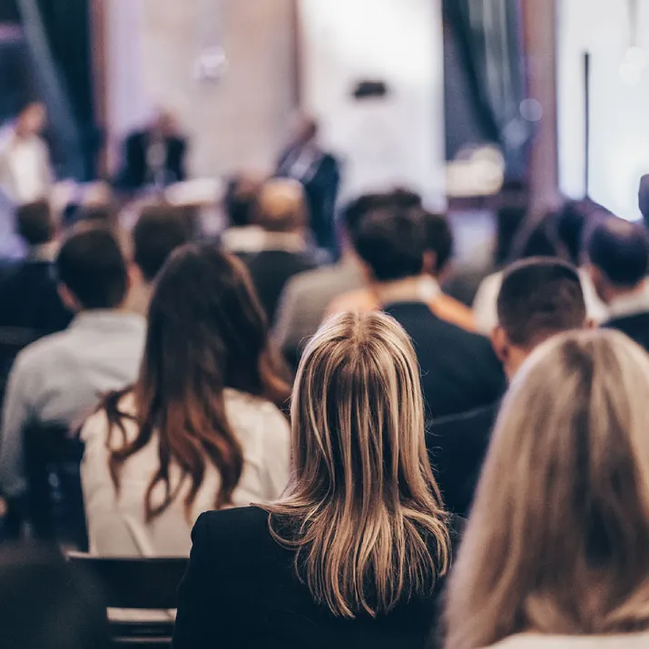 Audience listening at a conference