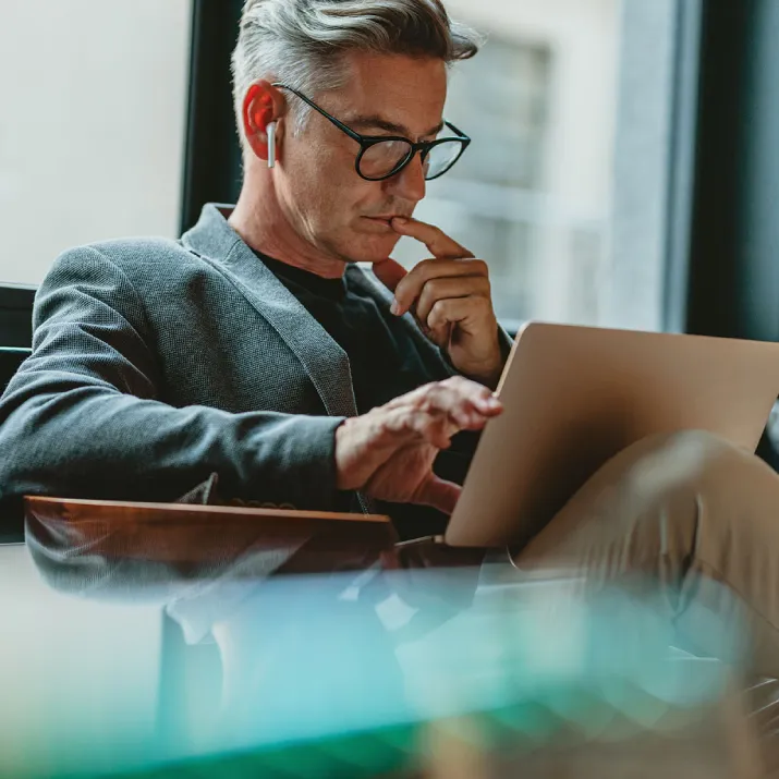 Man using laptop while seated