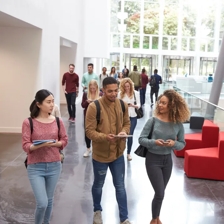 Students walking through university building